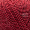 Merino Yak, de Regia Premium, une laine à chaussette qui réalise des bas chauds et doux, faciles à nettoyer.  Le grand classique des amateurs de plein air.  Coloris Himbeer Meliert, un rouge orangé.